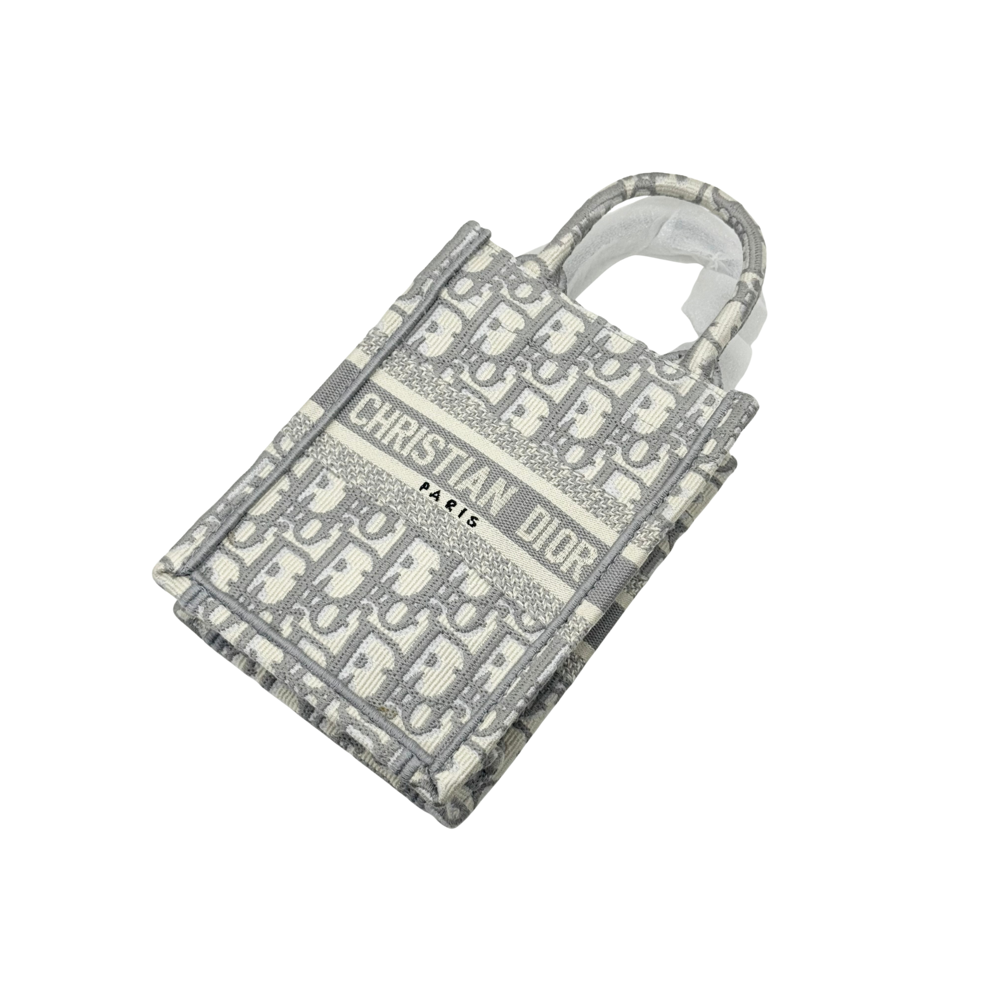 Gray-and-beige Dior monogram mini tote bag with top handles, angled