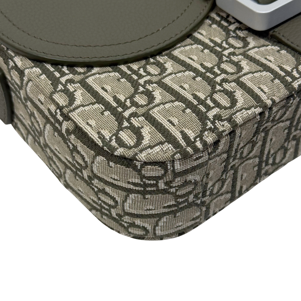 Dior crossbody bag with beige monogram fabric and stitched rounded corner