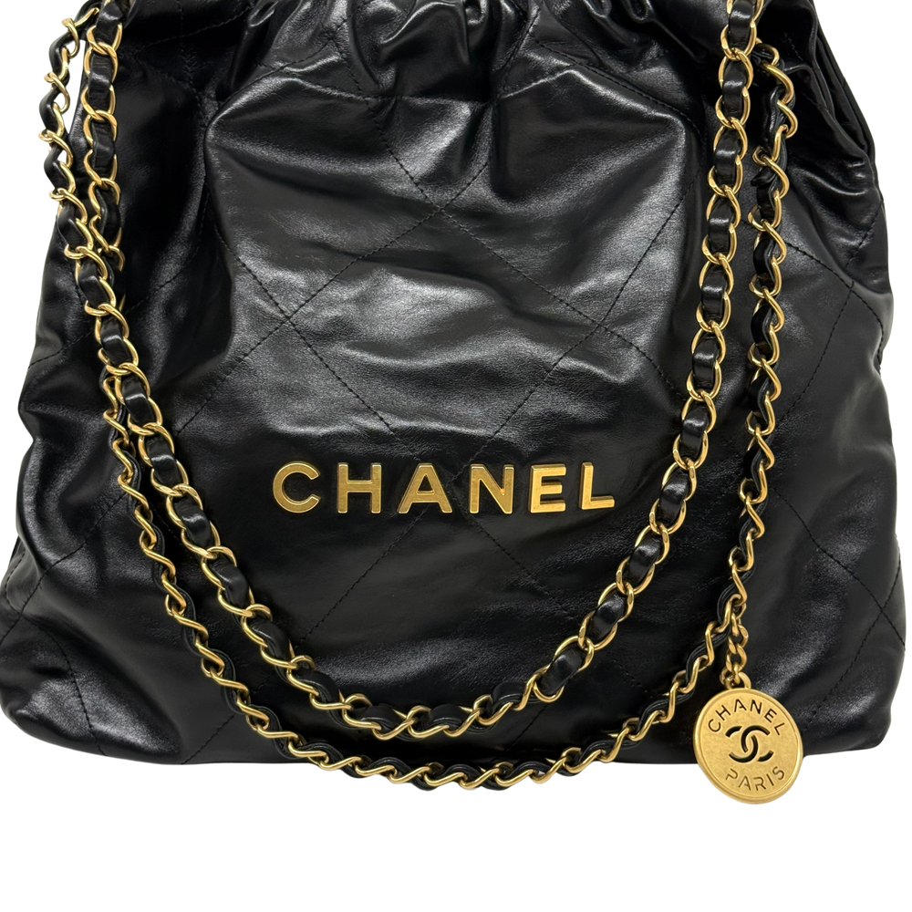Black quilted leather shoulder bag with CHANEL logo and double gold chain